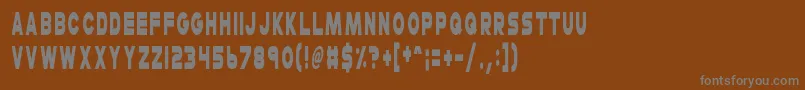 CheerioOldChap-Schriftart – Graue Schriften auf braunem Hintergrund