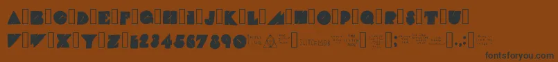 TheGlitchMob-Schriftart – Schwarze Schriften auf braunem Hintergrund