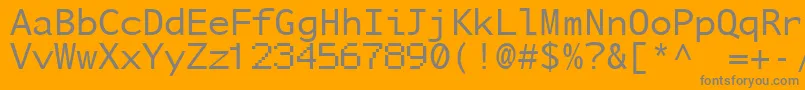 NuSansMonoDemo-fontti – harmaat kirjasimet oranssilla taustalla