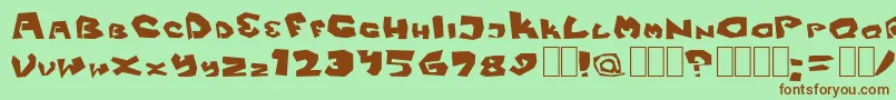 Fitsvamp-Schriftart – Braune Schriften auf grünem Hintergrund