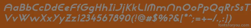NeogothisadfstdExtrabdoblique-fontti – harmaat kirjasimet ruskealla taustalla