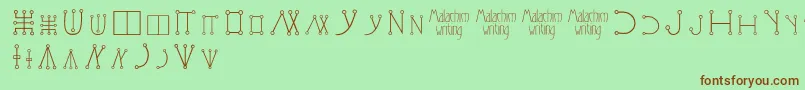 Malachimwriting Font – Brown Fonts on Green Background