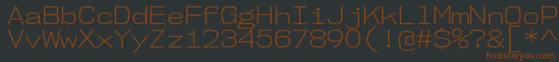 Nk57MonospaceSeLt Font – Brown Fonts on Black Background