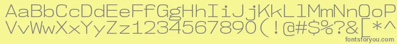 Nk57MonospaceSeLt Font – Gray Fonts on Yellow Background