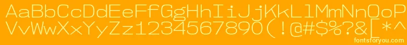 Nk57MonospaceSeLt-Schriftart – Gelbe Schriften auf orangefarbenem Hintergrund