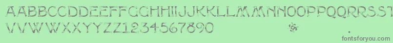 フォントMultiformcaps – 緑の背景に灰色の文字