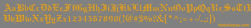 フォントElliott – オレンジの文字は灰色の背景にあります。