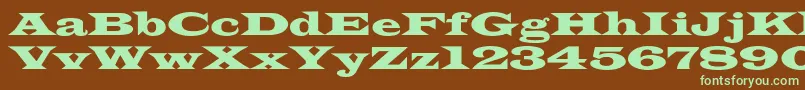 フォントAzlatinwidec – 緑色の文字が茶色の背景にあります。