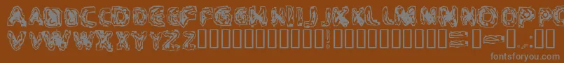 CriticalMass-Schriftart – Graue Schriften auf braunem Hintergrund