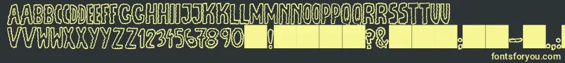 フォントJmhEscamasOut – 黒い背景に黄色の文字