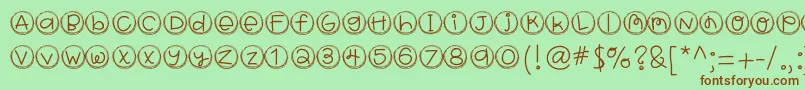 Hellobragtags-Schriftart – Braune Schriften auf grünem Hintergrund