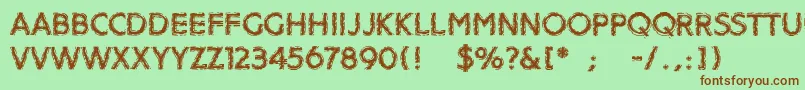 Distroya Font – Brown Fonts on Green Background