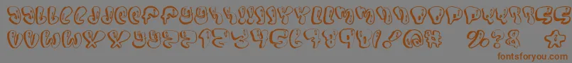 フォントSumo – 茶色の文字が灰色の背景にあります。