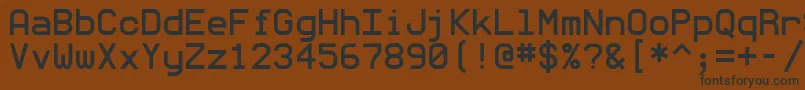 Monommm5-fontti – mustat fontit ruskealla taustalla