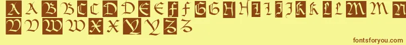 フォントBastardamajuskel1300 – 茶色の文字が黄色の背景にあります。