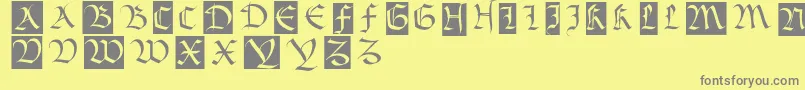 フォントBastardamajuskel1300 – 黄色の背景に灰色の文字