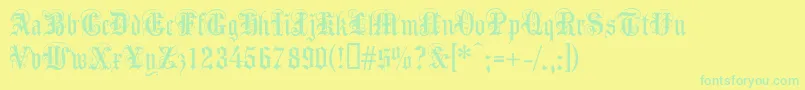Anglicantext Font – Green Fonts on Yellow Background