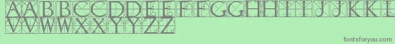 TypographerCaps-fontti – harmaat kirjasimet vihreällä taustalla