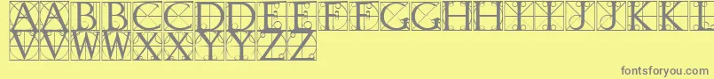 Fonte TypographerCaps – fontes cinzas em um fundo amarelo
