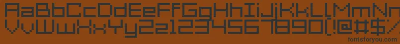 Acme7Wide Font – Black Fonts on Brown Background