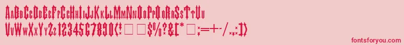 JudasMedium-fontti – punaiset fontit vaaleanpunaisella taustalla