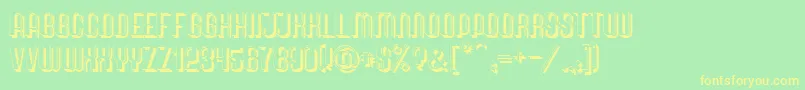 フォントQuimbieShaddow – 黄色の文字が緑の背景にあります