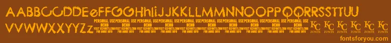 ThebizdemoKcfonts Font – Orange Fonts on Brown Background