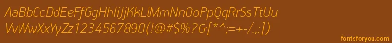 フォントPfhandbookproThinitalic – オレンジ色の文字が茶色の背景にあります。