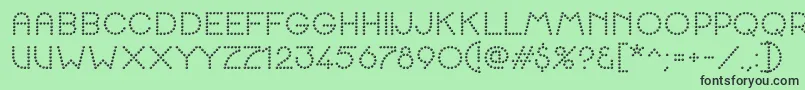 K22SpottyFace Font – Black Fonts on Green Background