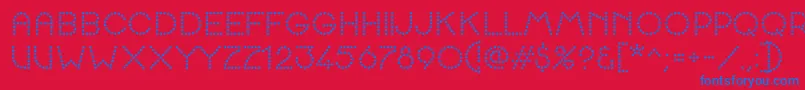 K22SpottyFace Font – Blue Fonts on Red Background
