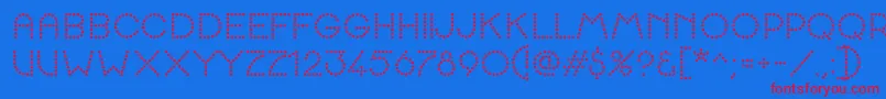 K22SpottyFace-Schriftart – Rote Schriften auf blauem Hintergrund