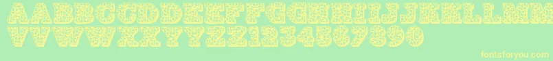 Czcionka Jfhollynites – żółte czcionki na zielonym tle