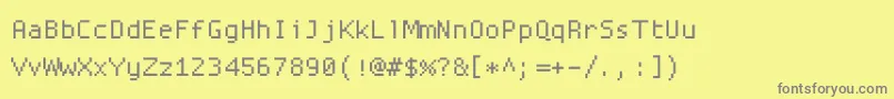 Proggysquaresz-fontti – harmaat kirjasimet keltaisella taustalla