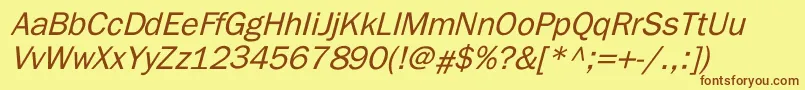 フォントElutheraItalic – 茶色の文字が黄色の背景にあります。