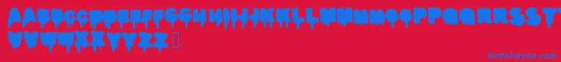 Realgraffiti-Schriftart – Blaue Schriften auf rotem Hintergrund