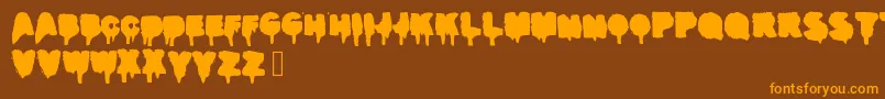 Realgraffiti-fontti – oranssit fontit ruskealla taustalla