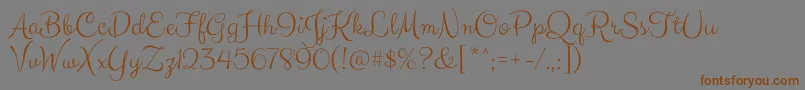 ClickerscriptRegular-Schriftart – Braune Schriften auf grauem Hintergrund