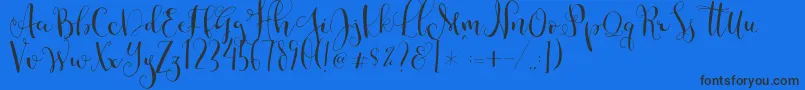 Cestlaisabellyalt-Schriftart – Schwarze Schriften auf blauem Hintergrund