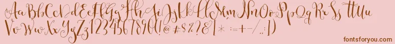 Cestlaisabellyalt-Schriftart – Braune Schriften auf rosa Hintergrund