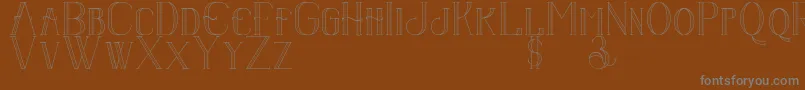 Senandungmalam-fontti – harmaat kirjasimet ruskealla taustalla