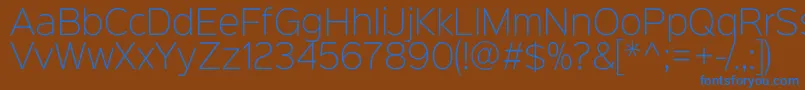 Sinkinsans200xlight-fontti – siniset fontit ruskealla taustalla