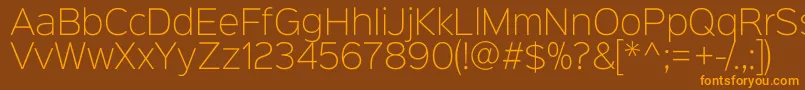 Czcionka Sinkinsans200xlight – pomarańczowe czcionki na brązowym tle