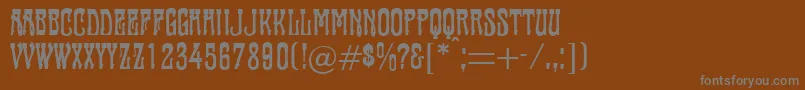 fuente Tambourin – Fuentes Grises Sobre Fondo Marrón