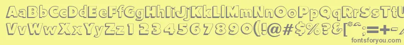 Vantage-fontti – harmaat kirjasimet keltaisella taustalla