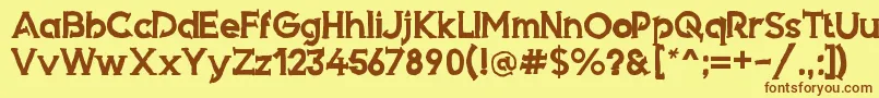 フォントArmed – 茶色の文字が黄色の背景にあります。