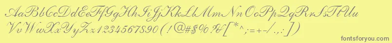 ShelleyLtAndanteScript-fontti – harmaat kirjasimet keltaisella taustalla