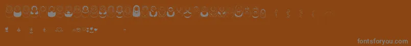 Matriochkas-Schriftart – Graue Schriften auf braunem Hintergrund