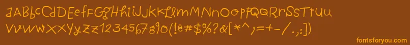 フォントChildwrittenBold – オレンジ色の文字が茶色の背景にあります。