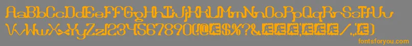 フォントDraggleOverKernedBrk – オレンジの文字は灰色の背景にあります。