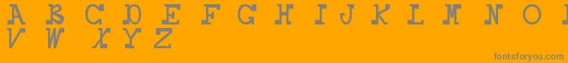 Daboss-fontti – harmaat kirjasimet oranssilla taustalla